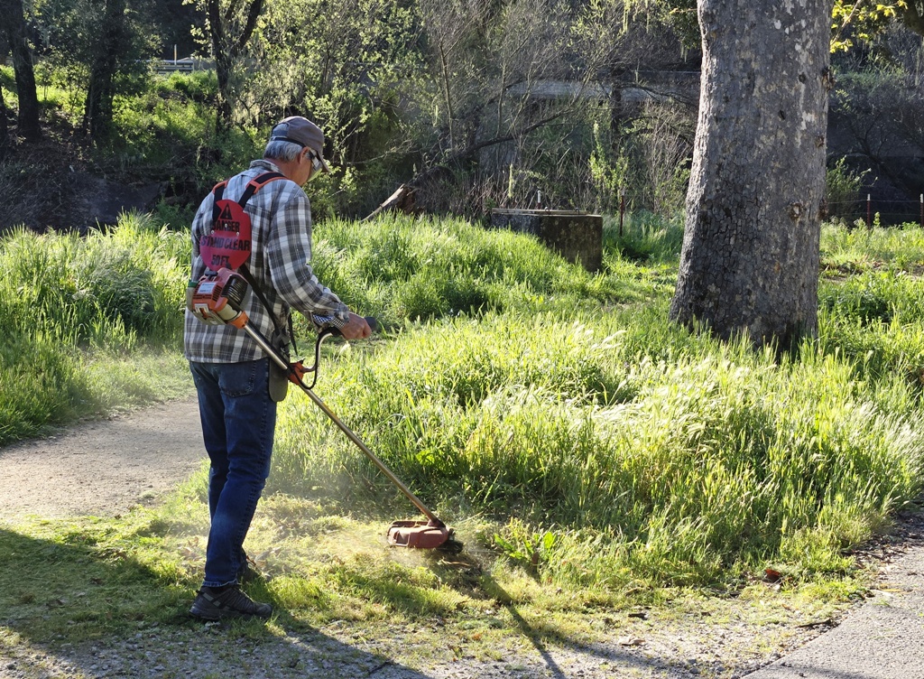 Chris mowing down the weeds!